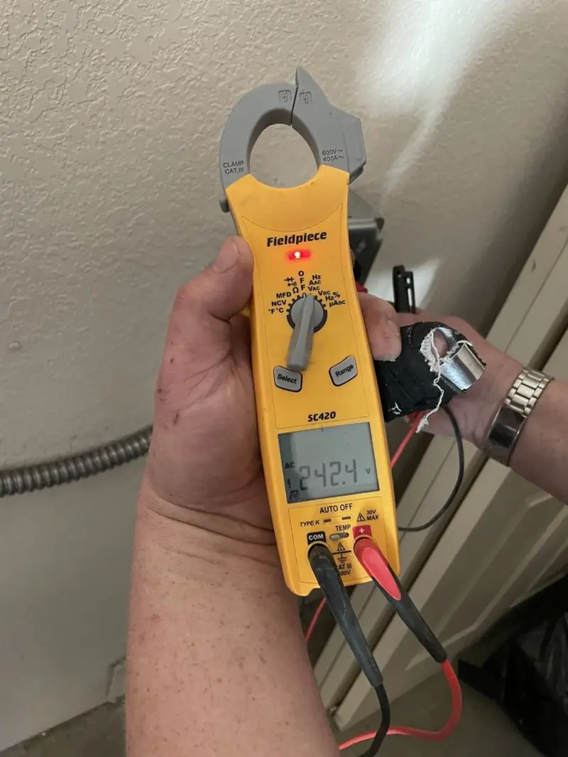 Voltage testing with clamp meter during Circuit Breaker Repair in West Branch